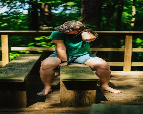 person relaxing and drinking water during a break