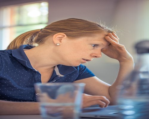customer support community manager working on laptop